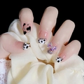 Press-on nails featuring cow print, 3D laser bow, and rhinestone accents on lace background - Cow Heart W82 (Boxed Tool Set)