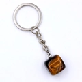 Irregular tiger eye stone keychain with silver metal ring and chain on white background - Tiger's Eye