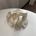 Close-up of cream satin scrunchie with layered ruffles and soft silk texture details - 16cm / Beige