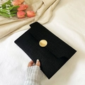 Chic black crocodile-embossed envelope clutch with round gold buckle and magnetic flap - Black