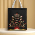 Black canvas Christmas tote bag with gold and red tree print on a display stand - Style 3