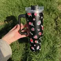 Black 40oz insulated travel tumbler with Love graffiti pattern and sturdy handle - A2 / Tattoo Graffiti Pattern