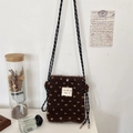 Close-up of brown plush crossbody bag with white star pattern and braided rope strap - Brown Heart