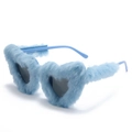 Macro detail of heart-shaped sunglasses with plush light blue faux fur frame and dark lenses - Blue