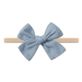 Detail of baby headband with dusty blue textured bow on a beige elastic nylon band - Dusty Blue Texture (7)