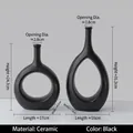 Set of two black minimalist ceramic vases with hollow design in matte finish - Black Set
