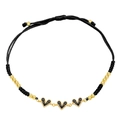 Detail of adjustable black woven bracelet with three black zircon heart pendants and gold beads - Black