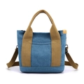 Blue canvas tote bag with brown handles and adjustable strap for crossbody use - Sky Blue