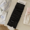 Dark grey ribbed knit leg warmers in slouch style with brand tag on white board - One Size / Dark Gray