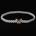 Elegant double-row pearl waist chain with a gold rhinestone butterfly buckle on black background - Gold Rhinestone Bowknot Artificial Pearl Buckle (Style 13)