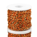 Golden stainless steel chain with orange enamel bead links wound on a spool for DIY jewelry - Gold-Orange