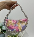 Detailed macro of a gradient sequin handbag featuring a crystal-embellished handle strap - Pastel Mermaid Sequin