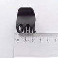 Detailed macro view of small 3.5cm matte black claw clip with ruler measuring size - 2.2cm / Matte Black