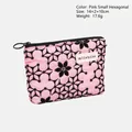 Pink cosmetic pouch with black floral pattern and circular metal zipper puller - Small Hexagon Bag / Pink
