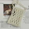 Handmade pearl beaded phone bag with diamond lattice pattern on an art book background - 13*18*2 / Pearl