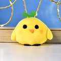 Close-up of a yellow plush chick with a green sprout on its head and soft fur texture. - Round Eye Style / Metal Bead Chain / Yellow