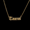 Macro shot of gold gothic Taurus pendant necklace made of durable stainless steel - Taurus - Gold