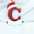 Sparkly red glitter letter C Christmas tree ornament with a festive Santa hat and ribbon - Letter C