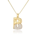 Macro detail of initial B pendant with gold hammered finish and zircon pavé setting - Letter B