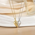 Close-up of magnetic heart necklaces with wavy textures and micro-paved zircons - Gold Silver Heartbeat Magnetic Heart XL0485