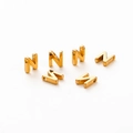 Close-up of six gold plated letter beads with 1.8mm holes for DIY jewelry making - Letter N / Gold