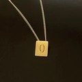 Macro view of 18K gold plated stainless steel square pendant featuring letter O engraving - Pendant Only / Letter O