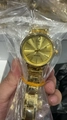 Elegant women's gold quartz watch with a metallic chain strap and sunburst dial - Gold Case Gold Dial