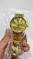 Elegant women's gold quartz watch with a metallic chain strap and sunburst dial - Gold Case Gold Dial