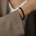 Minimalist 18K gold-plated titanium steel chain bracelet in black finish on wrist - Wide 6.3mm Bracelet (E489) / Black