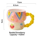 Pink and beige ceramic strawberry mug with unique yellow beaded handle 420ml capacity - Beaded Strawberry