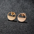 Minimalist geometric round earrings in gold finish with hollow circle design on gray background - 457 Rose Gold (Geometric)