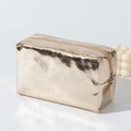 Detailed side view of laser gold PU makeup bag with metallic texture and zipper closure - Champagne