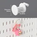 Set of 5 white pegboard hooks with 19mm diameter and 14.8mm hanging length for wall storage - Round Mini Hooks 5Pcs - White