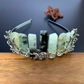 Detail view of silver branch tiara with green raw crystals and celestial moon icons - Prehnite + Triple Moon + Branch