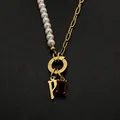 Stainless steel necklace with letter P pendant, pearls, and red gemstone detail - Gothic Letter P