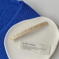 Detail of handmade golden clip with texture and France Handmade inscription on fabric - Rectangular Clip / Beige