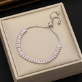 Detail of pink rectangular zircon bracelet with adjustable silver-tone sliding box chain - Pink