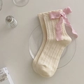 Knee-high cable knit socks in cream white with large light pink silk bow accents - One Size / Beige