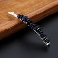 Detail of silver wavy hairpin featuring dark blue glittering natural crystal stones - Blue Sandstone with Silver Clip