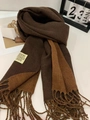Detail of color-block knit scarf with tassels, beige label and soft fringe texture - Mocha