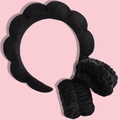 Detail of plush black headband and wristbands set for face washing on pink background - Black Sponge Headband (3-Piece Set)
