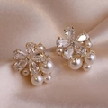 Elegant flower stud earrings with sparkling zircons and pearls on champagne silk fabric - Gold/White Pearl