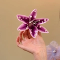 Detail shot of a purple fabric lily hair clip with elegant pearl embellishments - Duckbill Clip Only Style (34) / Purple
