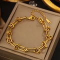 Close-up of gold-plated stainless steel twist chain bracelet with a secure lobster clasp - Gold Knot Rectangular Chain (JX715)