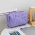 Purple floral quilted makeup bag with zipper closure and soft fabric texture - Irregular Purple Flowers