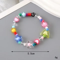 Handmade rainbow beaded bracelet featuring colorful butterfly and smiley face charms - Colorful Flower + Butterfly Style (K3345)