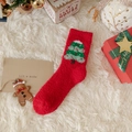 Red Christmas coral fleece sock featuring a green Christmas tree pattern on white rug - Christmas Tree / Crew