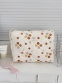 Detail der gesteppten Cord-Kosmetiktasche mit Blumendruck und stilvollem Webetikett - Cord-Handtasche Gelbe Blume