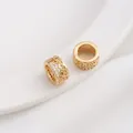 Macro view of 14K gold plated hollow floral spacer beads with sparkling zircon inlay - 13# Hollow Flower Tube / 10x5mm / 14K Gold