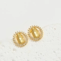 Close-up of gold oval earrings featuring Virgin Mary relief and cubic zirconia halo - Gold (White Zircon Mary Oval)
